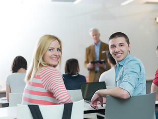 Image showing teacher with a group of students in classroom