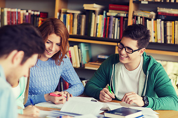 Image showing students preparing to exam and writing in library