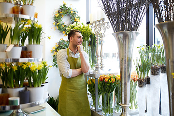 Image showing florist man or seller at flower shop