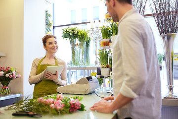 Image showing florist woman and man making order at flower shop