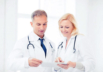 Image showing two doctors looking at tablet pc