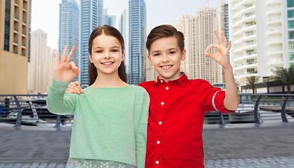 Image showing happy boy and girl showing ok hand sign