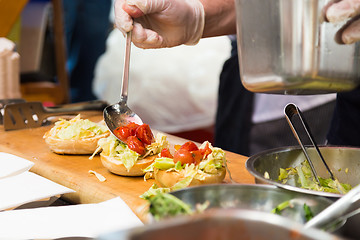 Image showing Beef burgers ready to serve on a food stall