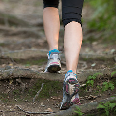 Image showing Pretty young girl jogging in nature. 