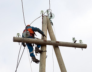 Image showing electrician working on the power lines after the accident