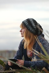 Image showing Woman Reading Outdoors