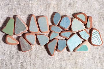 Image showing pieces of colorful tiles polished by the sea