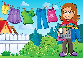 Image showing Woman with laundry outdoor