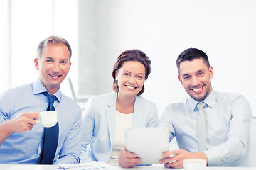 Image showing business team having fun with tablet pc in office