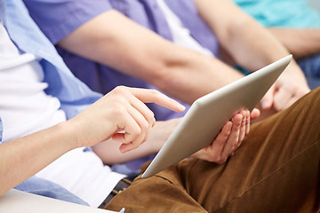 Image showing close up of friends with tablet pc at home