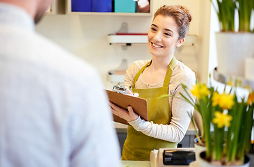 Image showing florist woman and man making order at flower shop