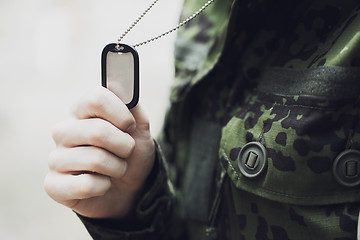 Image showing close up of young soldier in military uniform