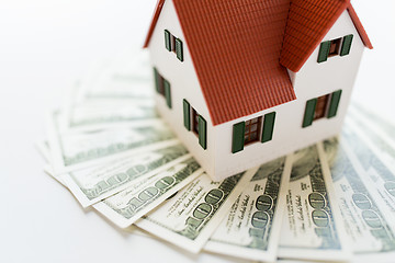 Image showing close up of home or house model and money