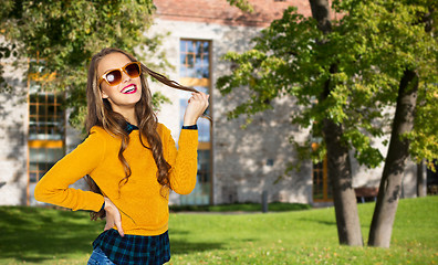 Image showing happy young woman or teen girl in casual clothes