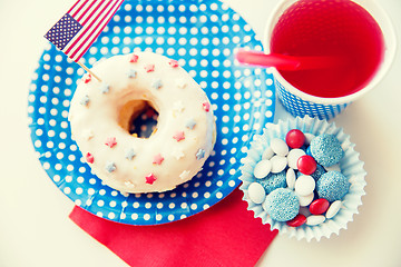 Image showing donut with juice and candies on independence day