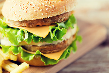 Image showing close up of hamburger or cheeseburger on table