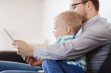 Image showing father and son with tablet pc playing at home