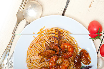 Image showing Italian seafood spaghetti pasta on red tomato sauce 