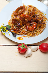 Image showing Italian seafood spaghetti pasta on red tomato sauce 