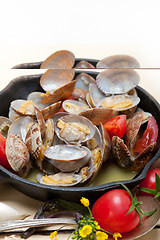 Image showing fresh clams on an iron skillet