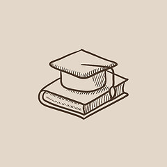 Image showing Graduation cap laying on book sketch icon.