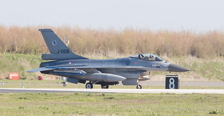 Image showing LEEUWARDEN, NETHERLANDS - APRIL 11, 2016: A dutch F-16 on the gr