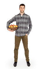 Image showing Healthy man with bowl full of apples