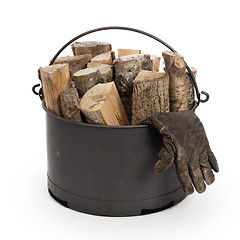 Image showing Metal basket of firewood