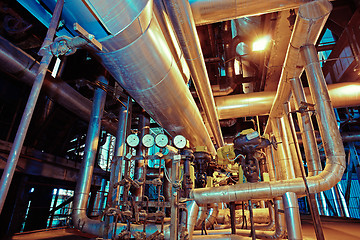 Image showing Equipment, cables and piping as found inside of a modern industr