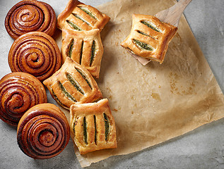 Image showing freshly baked cinnamon and spinach buns