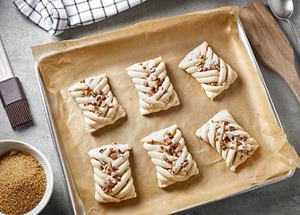 Image showing raw sweet buns on baking pan