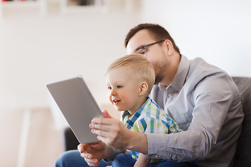 Image showing father and son with tablet pc playing at home