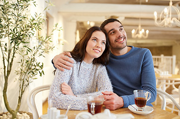 Image showing happy couple drinking tea at restaurant