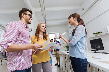 Image showing creative team on coffee break talking at office