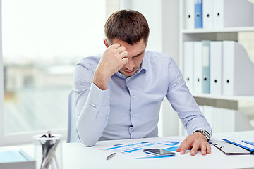 Image showing close up of businessman with smartphone