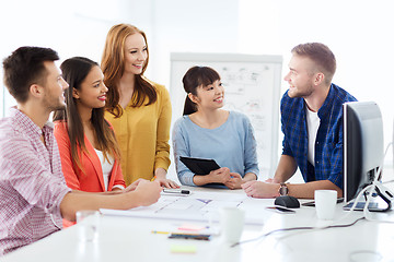 Image showing happy creative team or students working at office