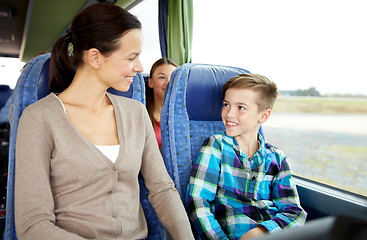 Image showing happy family riding in travel bus