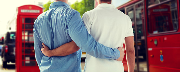 Image showing close up of gay couple hugging over london city