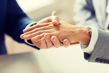 Image showing close up of male gay couple hands and wedding ring