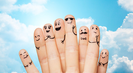 Image showing close up of hands and fingers with smiley faces