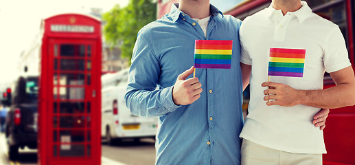 Image showing close up of gay couple hugging over london city