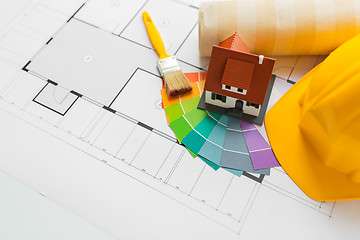 Image showing close up of house blueprint with building tools