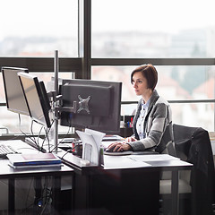 Image showing Business woman working in corporate office.