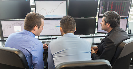 Image showing Business people looking at computer screens.