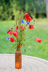 Image showing Bunch of of red poppies and cornflowers