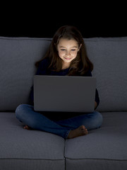 Image showing Little girl working with a laptop