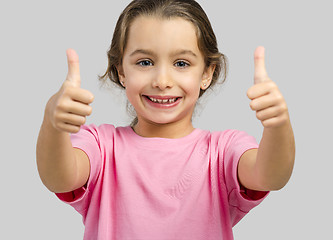Image showing Happy girl with thumbs up