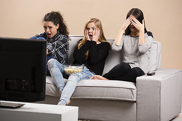 Image showing Scared teenage watching movies 
