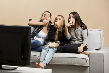 Image showing Scared teenage watching movies 