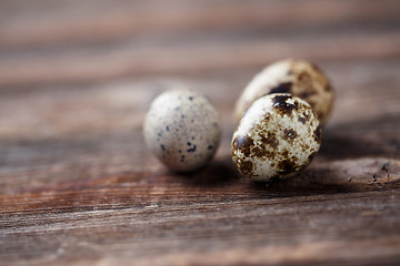 Image showing Group of quail eggs on thewooden background